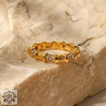 Gold-toned bamboo-style ring with embedded crystals in 18K Gold Bamboo Band design