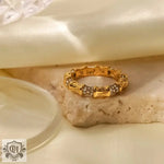 Gold-toned 18K Gold Bamboo Band Ring featuring bamboo-like segments and stones