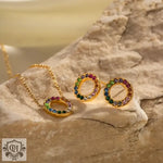 18K Gold Circle Design earrings and necklace featuring vibrant zirconia gemstones