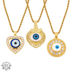 Three gold-toned necklaces featuring 18K gold devil’s eye design and geometric accents