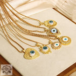 18K gold elegant geometric diamond-studded devil’s eye pendant necklace design