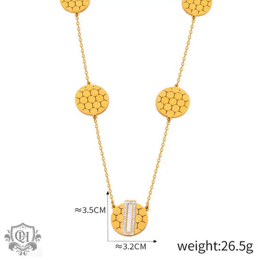 Elegant 18K gold necklace featuring a geometric round honeycomb design pendant