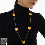 18K gold geometric round necklace featuring an elegant honeycomb design and inlaid gemstones