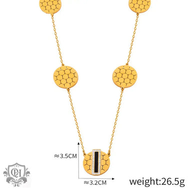 Gold-toned honeycomb patterned necklace featuring 18K gold and geometric round design