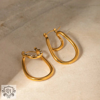 Gold-toned teardrop earrings featuring a double-layer arc design in 18k gold light luxury style