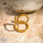 Gold-colored double-loop ring featuring 18k gold in a simple style line design