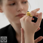 18k Gold Ring with Unique Double Ball Design featuring a striking gold-colored double-sphere