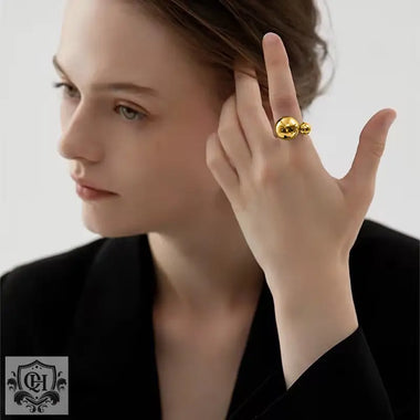 18k Gold Ring showcasing a unique double ball design with elegant gold color