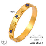 Gold-toned clover-motif bangle showcasing 18K gold in light luxury style design