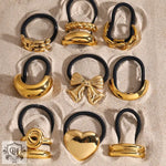 Nine gold-toned hair ties featuring 18K gold geometric design hair accessories