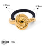 Gold knot hair tie showcasing 18K gold geometric design for elegant hair accessories