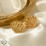 Two textured 18K gold shell-shaped earrings in elegant beach style light luxury design