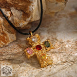 Gold cross pendant with colorful gemstones in light luxury 18K gold design