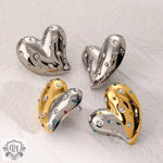 Heart-shaped stud earrings in high-quality 18K gold with dazzling embedded gems