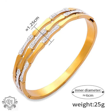 Gold-toned bangle bracelet with sparkling diamonds and exquisite 18K gold design elements