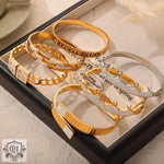 Assorted gold and silver bracelets featuring 18K gold and sparkling diamonds design elements