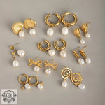 Gold earrings with pearl drops in light luxury style featuring ginkgo and bow design