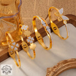 Gold-toned jeweled bangle bracelets in light luxury style featuring 18K gold design