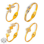 Four gold-toned bracelets with charms embodying light luxury style in 18K gold