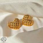 Two 18k gold heart shape earrings featuring an exquisite diamond pattern design