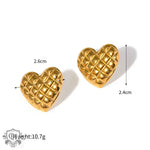 Two exquisite 18k gold heart-shaped earrings featuring a diamond pattern design