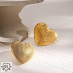 Two textured gold heart shapes from 18k gold earrings with a simple style design