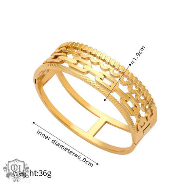 Gold-toned leaf-motif bangle showcasing unique artistic beauty in 18K gold with hollow designs