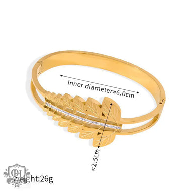 Gold-toned leaf-motif bangle with crystal accents in 18k gold hollow designs showcasing unique artistic beauty