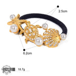 Gold-toned sea-themed hair tie with pearls and rhinestones in 18K gold light luxury style