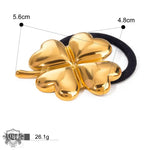 Gold clover hair tie featuring 18K gold in a light luxury style design