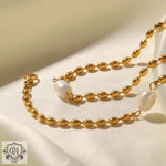 18K Gold Freshwater Pearl Oval Beanie Bracelet showcasing a gold chain necklace with pearls