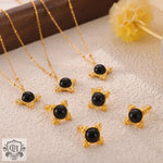 18K gold light luxury style necklace and earrings set with black stone pendants