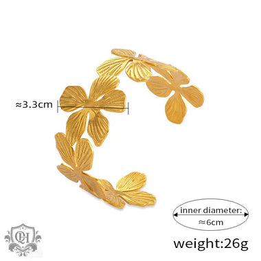 Gold-colored floral cuff bracelet featuring 18K gold and light luxury flower design