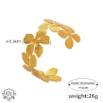 Gold-colored floral cuff bracelet featuring 18K gold and light luxury flower design