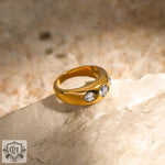 Elegant 18k gold ring with three zircon crystals, ideal for daily wear and formal occasions