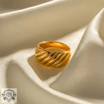 Gold-colored ridged ring showcasing elegant 18K gold ribbed design for sophisticated style