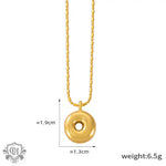 Gold-toned donut pendant necklace in 18K gold, embodying light luxury style elegance