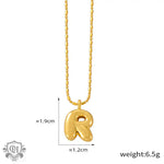 Gold-toned R initial pendant necklace in 18K gold, epitomizing light luxury style