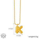 Gold-toned K initial necklace in 18K gold, embodying light luxury style elegance