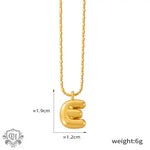 Gold letter E pendant necklace in 18K gold, embodying light luxury style elegance