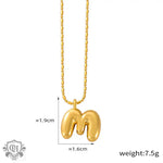 18K gold ’M’ pendant necklace showcasing light luxury style in elegant design