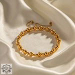 Gold beaded bracelet showcasing 18K Gold Simple Ball Design for versatile elegance