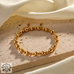 Gold beaded bracelet showcasing 18K Gold Simple Ball Design for versatile elegance