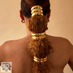 Elegant 18K gold hair accessory featuring double-layer design on curly ponytail