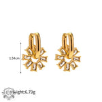 Gold hoop earrings featuring crystal flower pendants in 18K Gold Snowflake design