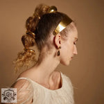 Woman showcasing 18K gold hair accessories with a stylish geometric design