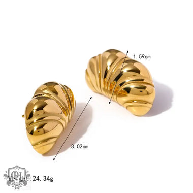 Shiny gold and silver chubby croissant earrings featuring 18k gold texture design