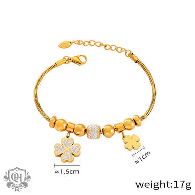 Gold-toned 18K Gold jewelry set featuring lucky four-leaf clover and heart charms