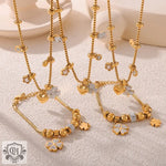 Gold-toned 18K Gold jewelry set featuring lucky four-leaf clover and heart charms