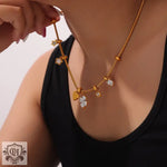 Gold charm necklace from 18K Gold Trendy Fashion Lucky Four Leaf Clover Bracelet Set